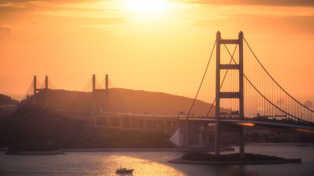 Aerial Shot City Buildings Hills Bridge River Sunset 1